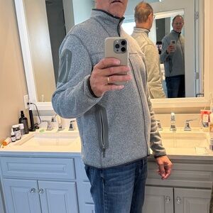 Arc'teryx Gray Fleece zip-up sweater. Gray Green zipper and pockets.